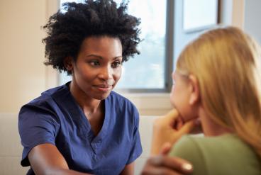 mental health nurse providing support to patient
